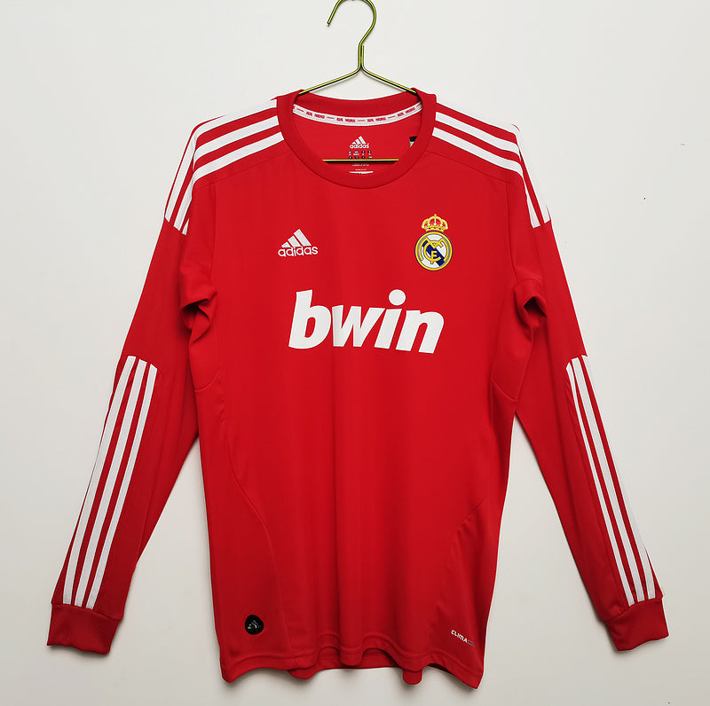 big_7_38da48f2-9896-45f0-a68f-d12d756b05b0 EQUIPACIÓN RETRO REAL MADRID 2011-12 MANGA LARGA ROJA - Imagen 1